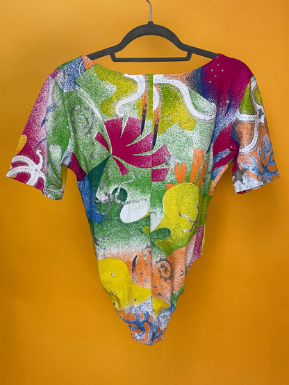 Süßer 90s Sommerbody von Michel Adam mit buntem Glitzerprint